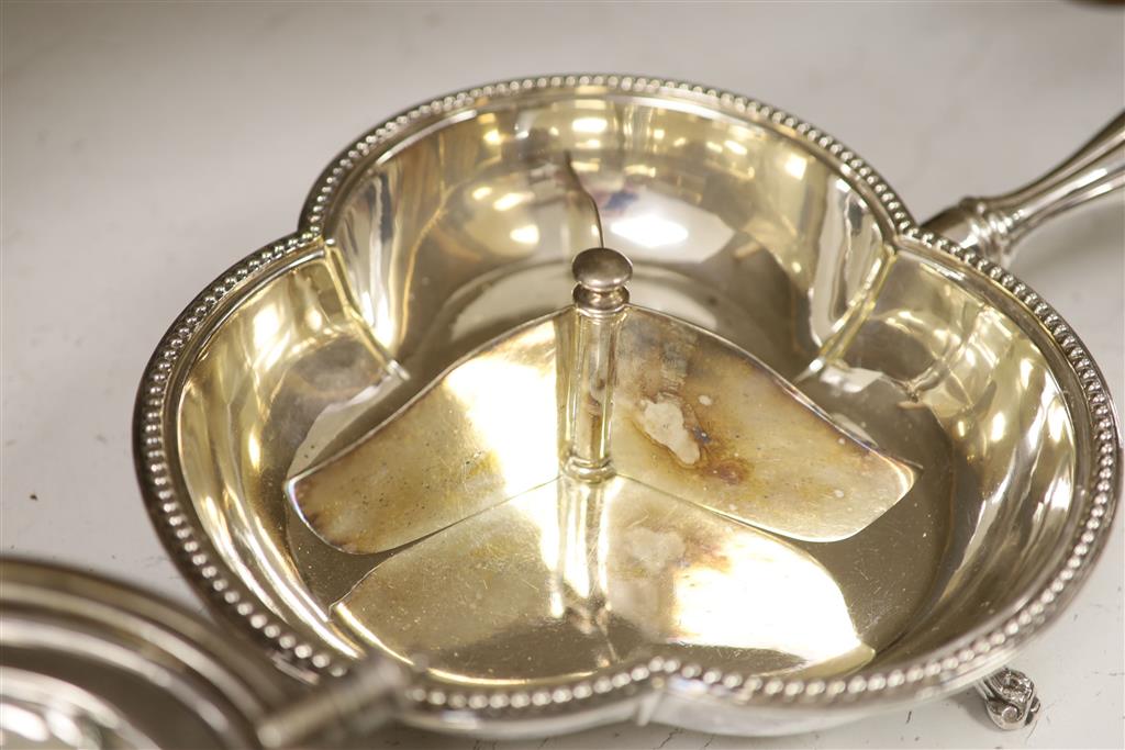 A good quality late 19th century silver-plated warming dish, of clover form, with a shaped cover,